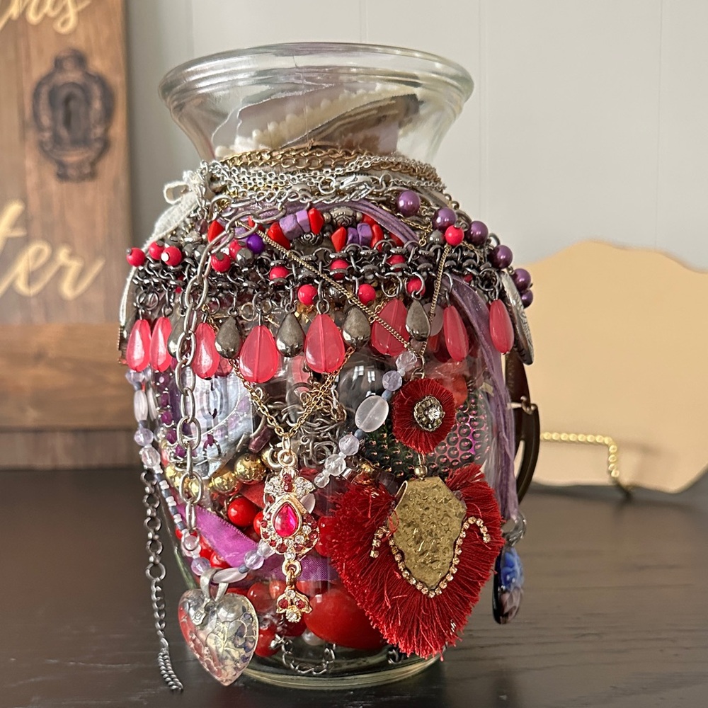 Beautiful And Colorful Jewelry Collection In A Mystery Jar In Red And Purple.